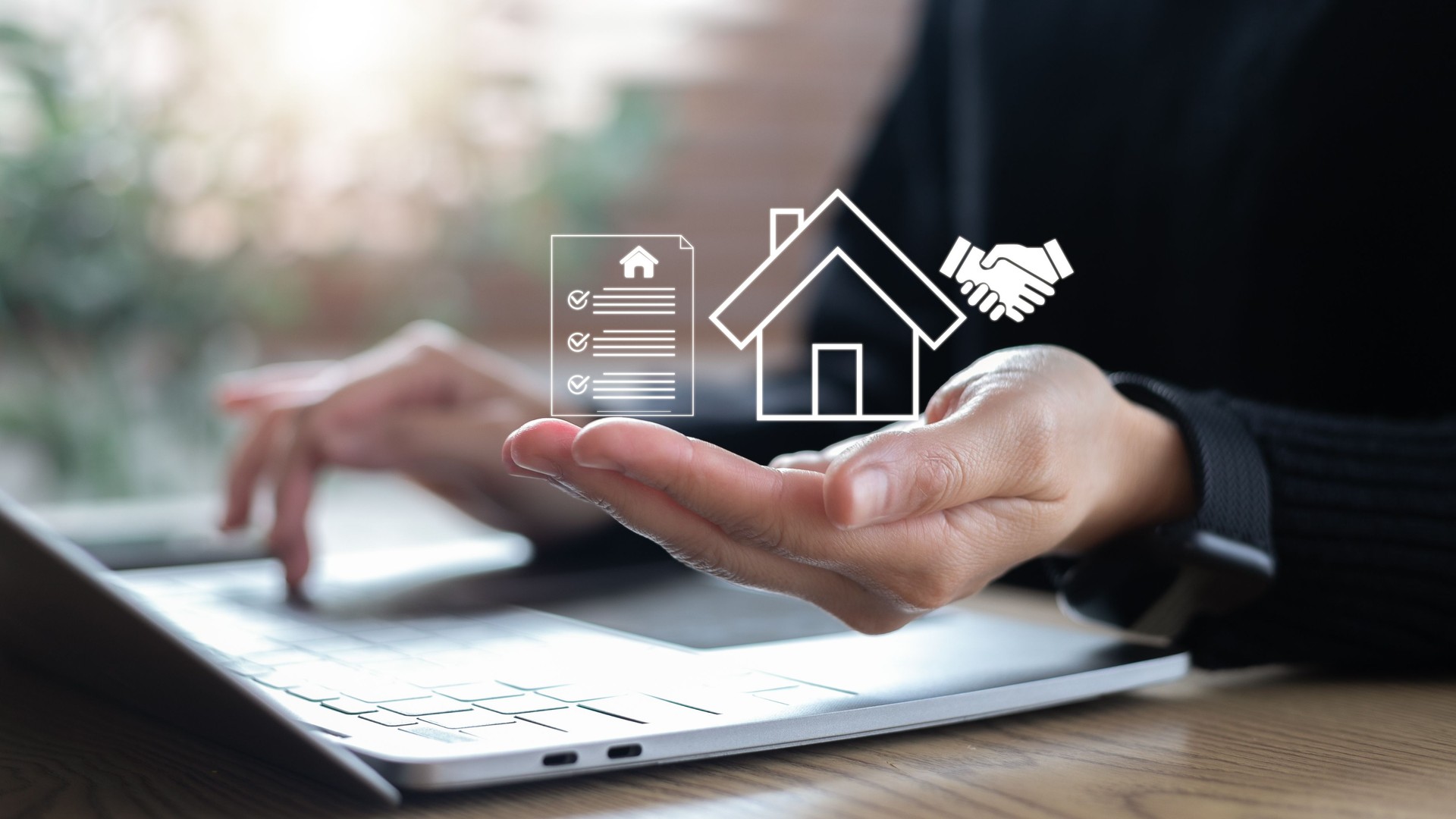 Closeup hand holding digital house contract icon with handshake, concept of online property transaction, smart real estate, and digital housing agreement.